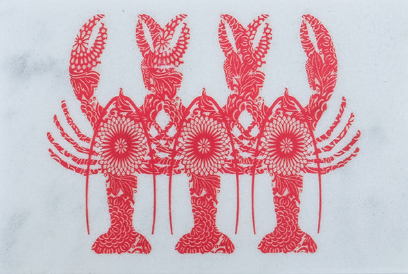 Red Lobster Triplets on Marble Trivet